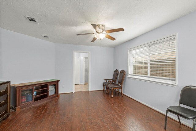 15119 Plaza Libre Dr, Houston, TX 77083 - sitting room featuring a ceiling fan, wood finished floors, and baseboards