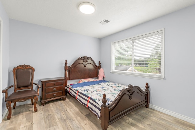 15119 Plaza Libre Dr, Houston, TX 77083 - bedroom featuring light wood-type flooring and baseboards