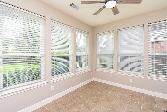 7111 Morrow Ct, Sugar Land, TX 77479 - unfurnished sunroom featuring baseboards and tile patterned floors