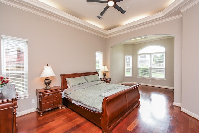 7111 Morrow Ct, Sugar Land, TX 77479 - bedroom with arched walkways, ornamental molding, dark wood-type flooring, and a ceiling fan
