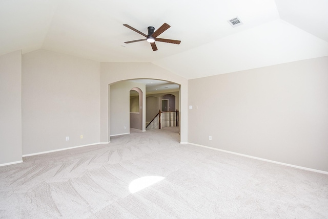 7111 Morrow Ct, Sugar Land, TX 77479 - spare room featuring vaulted ceiling, ceiling fan, arched walkways, and light colored carpet