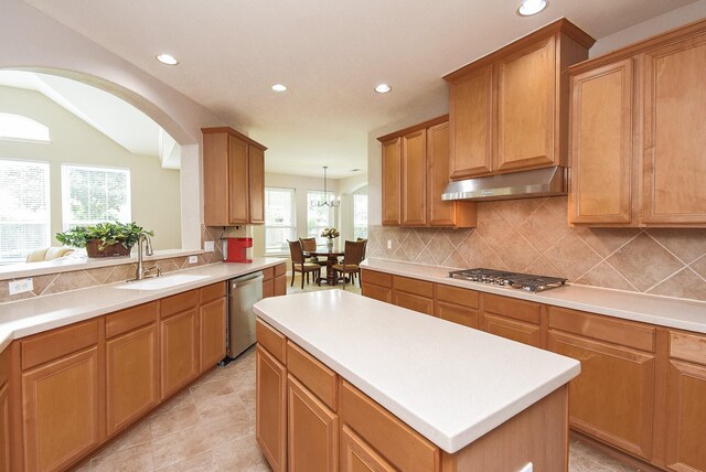 7111 Morrow Ct, Sugar Land, TX 77479 - kitchen featuring appliances with stainless steel finishes, extractor fan, recessed lighting, decorative backsplash, and light countertops