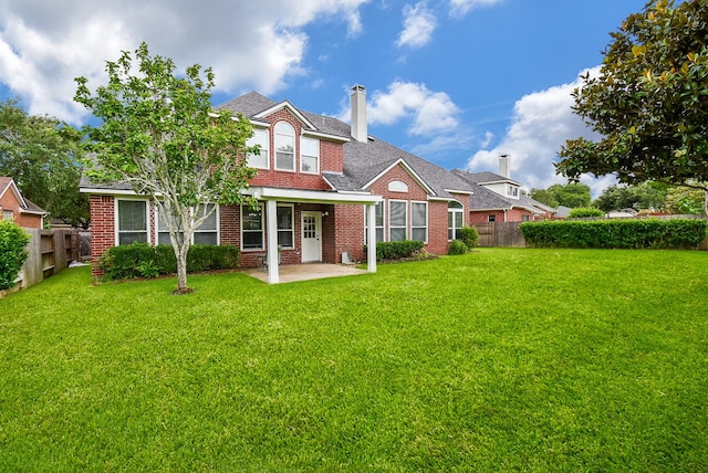 7111 Morrow Ct, Sugar Land, TX 77479 - rear view of house featuring a chimney, a patio area, and brick siding