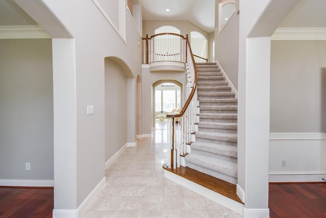 7111 Morrow Ct, Sugar Land, TX 77479 - stairs featuring arched walkways and baseboards