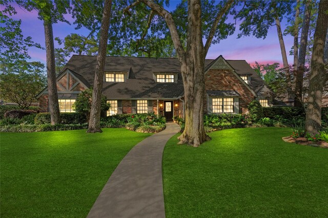 12214 Cobblestone Dr, Houston, TX 77024 - view of front facade featuring a front lawn and brick siding