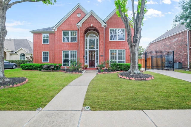 12427 Shadycrest Dr, Houston, TX 77082 - view of front facade with a gate, cooling unit, brick siding, and driveway