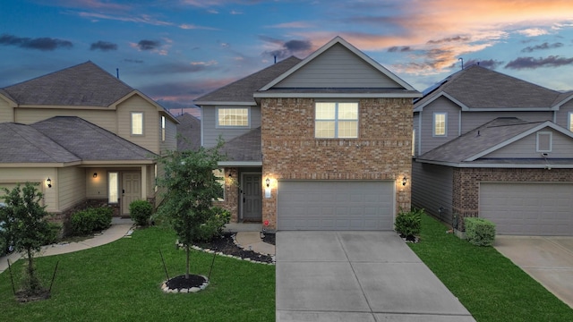 24739 Lorenzo Glaze Trl, Katy, TX 77493 - traditional home with brick siding, driveway, and a front yard