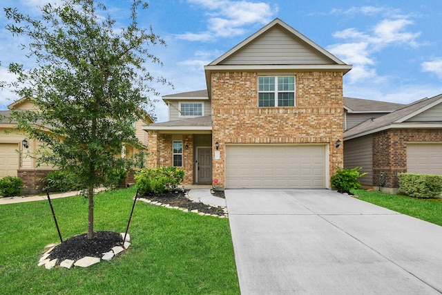 24739 Lorenzo Glaze Trl, Katy, TX 77493 - view of front of home featuring brick siding, driveway, a front yard, and an attached garage