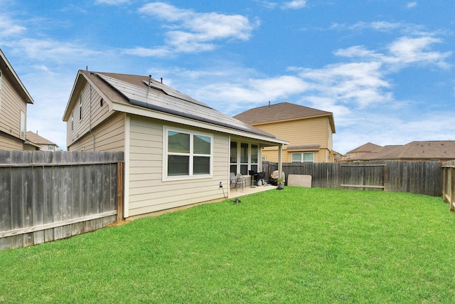 24739 Lorenzo Glaze Trl, Katy, TX 77493 - back of house with a patio area and solar panels