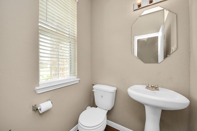 24739 Lorenzo Glaze Trl, Katy, TX 77493 - half bath featuring toilet and baseboards