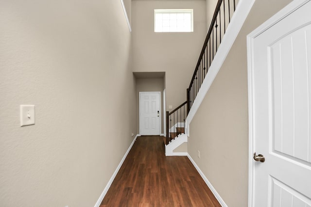 24739 Lorenzo Glaze Trl, Katy, TX 77493 - entrance foyer with baseboards, a towering ceiling, stairway, and dark wood finished floors