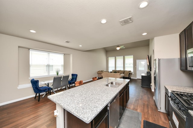 24739 Lorenzo Glaze Trl, Katy, TX 77493 - kitchen featuring dishwasher, a sink, healthy amount of natural light, gas range, and recessed lighting