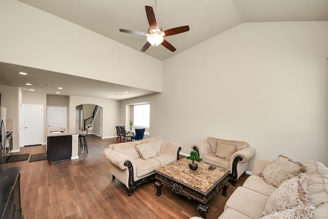 24739 Lorenzo Glaze Trl, Katy, TX 77493 - living area with arched walkways, ceiling fan, vaulted ceiling, dark wood-type flooring, and recessed lighting