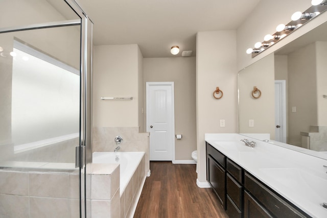 24739 Lorenzo Glaze Trl, Katy, TX 77493 - full bath with toilet, a garden tub, double vanity, wood finished floors, and a stall shower