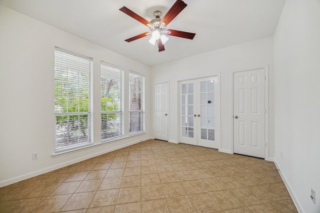 26402 Larkspur Ridge Dr, Katy, TX 77494 - spare room with plenty of natural light, a ceiling fan, french doors, and baseboards