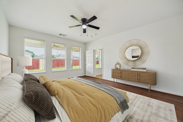 26402 Larkspur Ridge Dr, Katy, TX 77494 - bedroom with multiple windows, wood finished floors, baseboards, and a ceiling fan