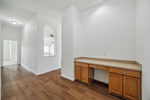 26402 Larkspur Ridge Dr, Katy, TX 77494 - unfurnished office featuring built in desk, dark wood-style flooring, a ceiling fan, and baseboards