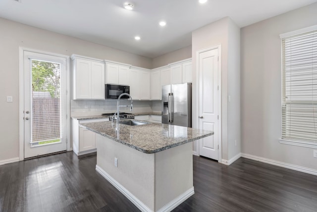 5021 Lehman Oaks Dr, Houston, TX 77018 - kitchen featuring stainless steel refrigerator with ice dispenser, black microwave, dark wood-type flooring, white cabinetry, and recessed lighting