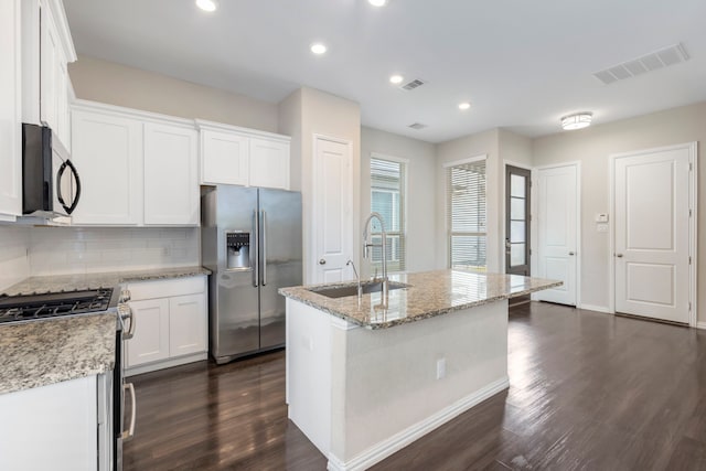 5021 Lehman Oaks Dr, Houston, TX 77018 - kitchen with appliances with stainless steel finishes, a sink, dark wood-style floors, decorative backsplash, and recessed lighting