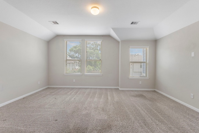 5021 Lehman Oaks Dr, Houston, TX 77018 - spare room with lofted ceiling, light carpet, and baseboards