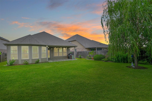 11514 Harmony Summit Trce, Richmond, TX 77406 - back of property at dusk featuring a patio