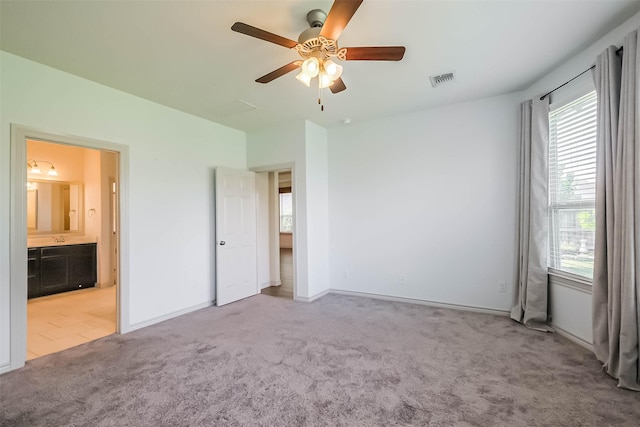 11514 Harmony Summit Trce, Richmond, TX 77406 - unfurnished bedroom with carpet floors, connected bathroom, and ceiling fan