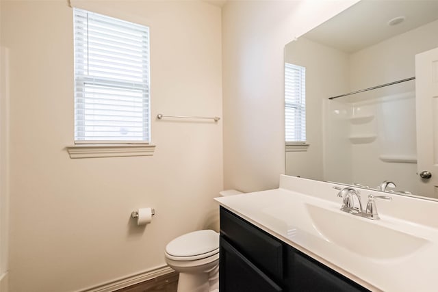 11514 Harmony Summit Trce, Richmond, TX 77406 - bathroom with vanity, a shower, and wood finished floors