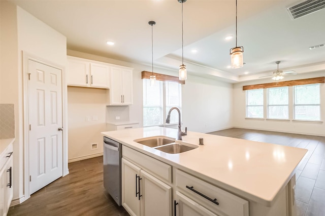 11514 Harmony Summit Trce, Richmond, TX 77406 - kitchen featuring stainless steel dishwasher, dark wood-style floors, white cabinets, ceiling fan, and light countertops