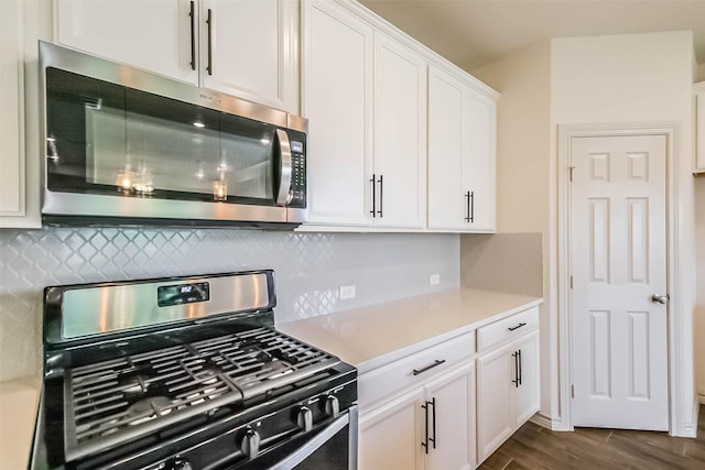 11514 Harmony Summit Trce, Richmond, TX 77406 - kitchen with stainless steel appliances, light countertops, decorative backsplash, and dark wood-type flooring