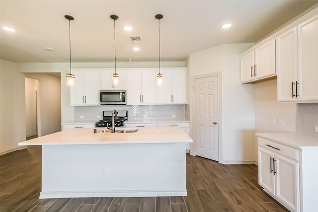 11514 Harmony Summit Trce, Richmond, TX 77406 - kitchen featuring stainless steel microwave, range, tasteful backsplash, light countertops, and recessed lighting