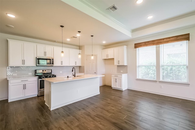 11514 Harmony Summit Trce, Richmond, TX 77406 - kitchen featuring appliances with stainless steel finishes, decorative backsplash, dark wood-type flooring, light countertops, and recessed lighting