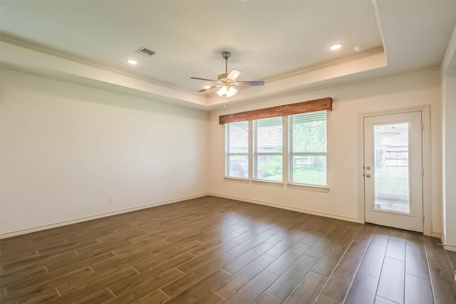 11514 Harmony Summit Trce, Richmond, TX 77406 - unfurnished room featuring a tray ceiling, dark wood finished floors, ceiling fan, and recessed lighting