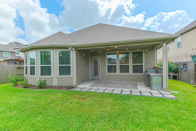 11514 Harmony Summit Trce, Richmond, TX 77406 - back of house featuring a shingled roof and a patio area
