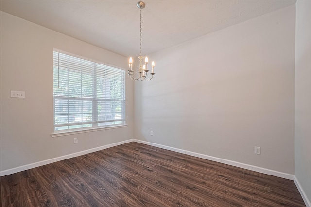 24523 Carlton Springs Ln, Katy, TX 77494 - spare room with a chandelier, dark wood-style floors, and baseboards