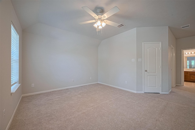 24523 Carlton Springs Ln, Katy, TX 77494 - additional living space featuring light colored carpet, a ceiling fan, healthy amount of natural light, and lofted ceiling