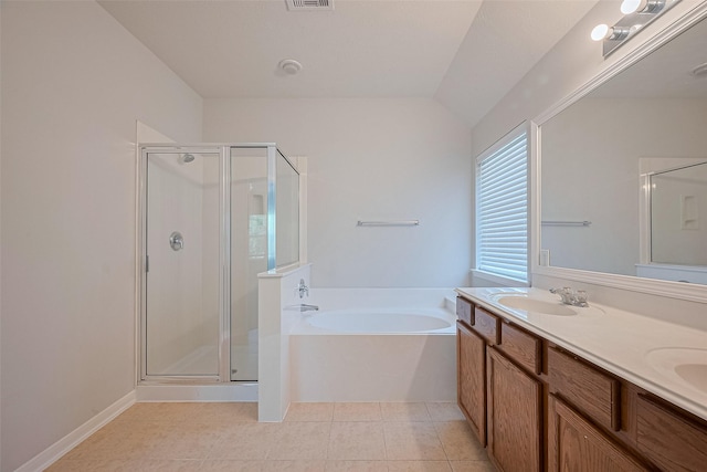 24523 Carlton Springs Ln, Katy, TX 77494 - bathroom with a shower stall, a bath, double vanity, tile patterned flooring, and lofted ceiling