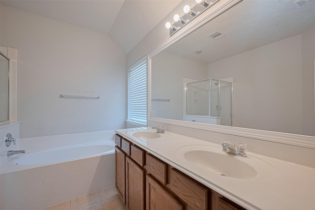 24523 Carlton Springs Ln, Katy, TX 77494 - full bathroom with a shower stall, a garden tub, double vanity, tile patterned flooring, and lofted ceiling