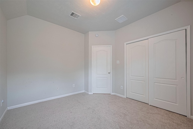 24523 Carlton Springs Ln, Katy, TX 77494 - unfurnished bedroom with carpet floors, lofted ceiling, baseboards, and a closet