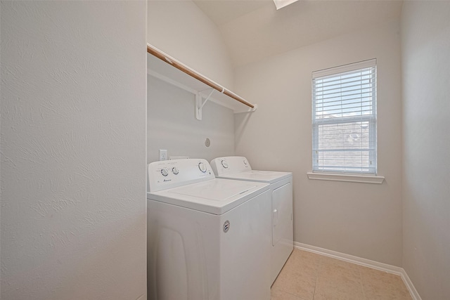 24523 Carlton Springs Ln, Katy, TX 77494 - laundry room featuring washing machine and dryer, light tile patterned floors, and baseboards