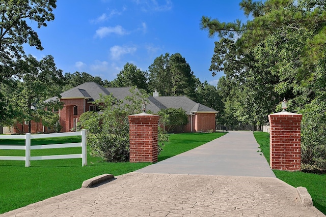 15569 Zoe Loop Dr, Montgomery, TX 77316 - view of front facade featuring brick siding and driveway