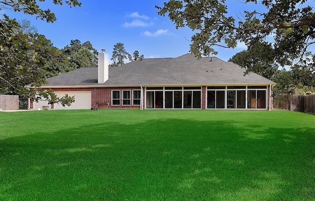15569 Zoe Loop Dr, Montgomery, TX 77316 - back of property with a chimney, a sunroom, brick siding, and a shingled roof