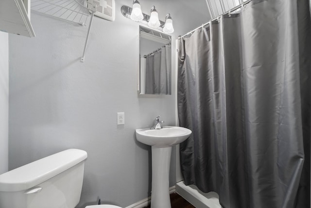 1726 Bowler Rd, Waller, TX 77484 - bathroom with toilet, curtained shower, and a sink