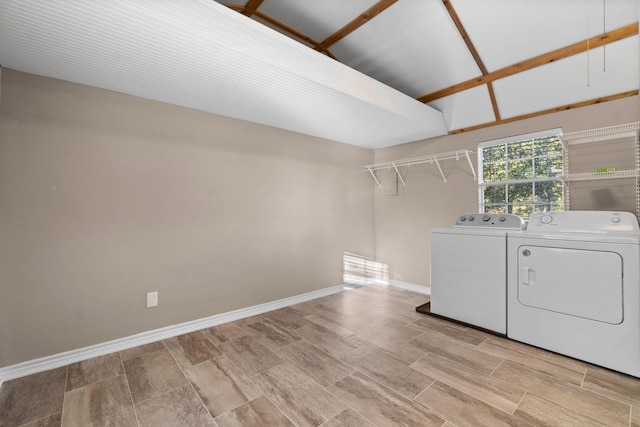 1726 Bowler Rd, Waller, TX 77484 - laundry area with washing machine and clothes dryer, baseboards, and light wood finished floors