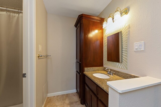 2611 Grants Lake Blvd Unit 222, Sugar Land, TX 77479 - bathroom with vanity and tile patterned floors