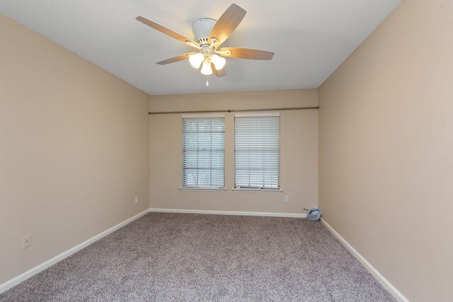 2611 Grants Lake Blvd Unit 222, Sugar Land, TX 77479 - spare room featuring carpet flooring, ceiling fan, and baseboards