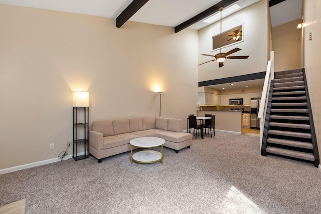 2611 Grants Lake Blvd Unit 222, Sugar Land, TX 77479 - living area with carpet flooring, stairs, a ceiling fan, beam ceiling, and baseboards