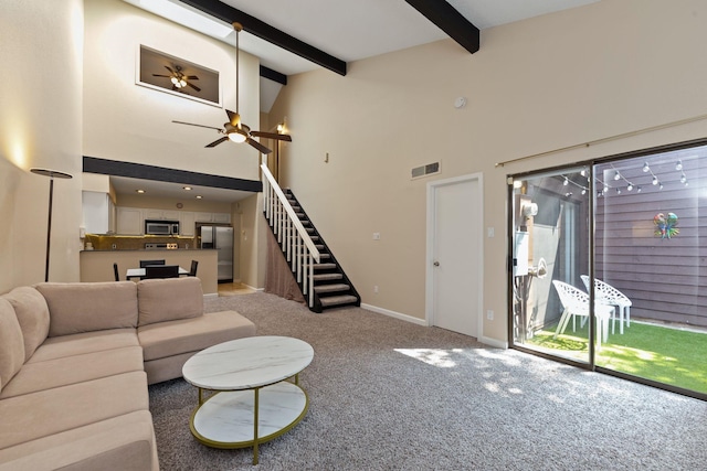 2611 Grants Lake Blvd Unit 222, Sugar Land, TX 77479 - carpeted living area with stairs, beamed ceiling, a ceiling fan, high vaulted ceiling, and baseboards
