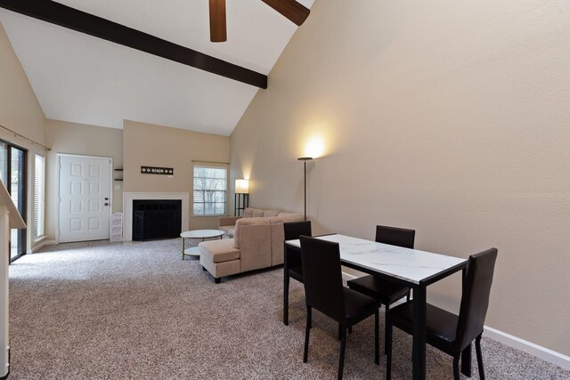 2611 Grants Lake Blvd Unit 222, Sugar Land, TX 77479 - dining space featuring carpet, high vaulted ceiling, beamed ceiling, a fireplace, and ceiling fan