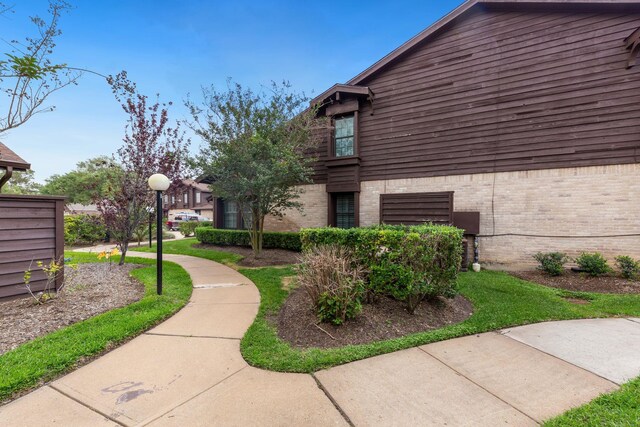 2611 Grants Lake Blvd Unit 222, Sugar Land, TX 77479 - view of property exterior featuring brick siding