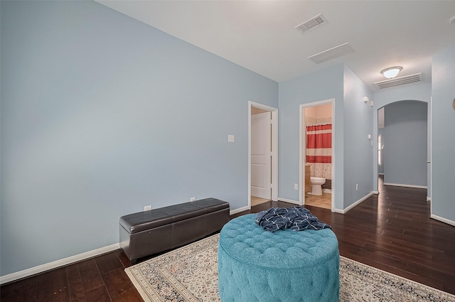1911 Cadbury Castle Ln, Fresno, TX 77545 - living area with arched walkways, hardwood / wood-style flooring, and baseboards